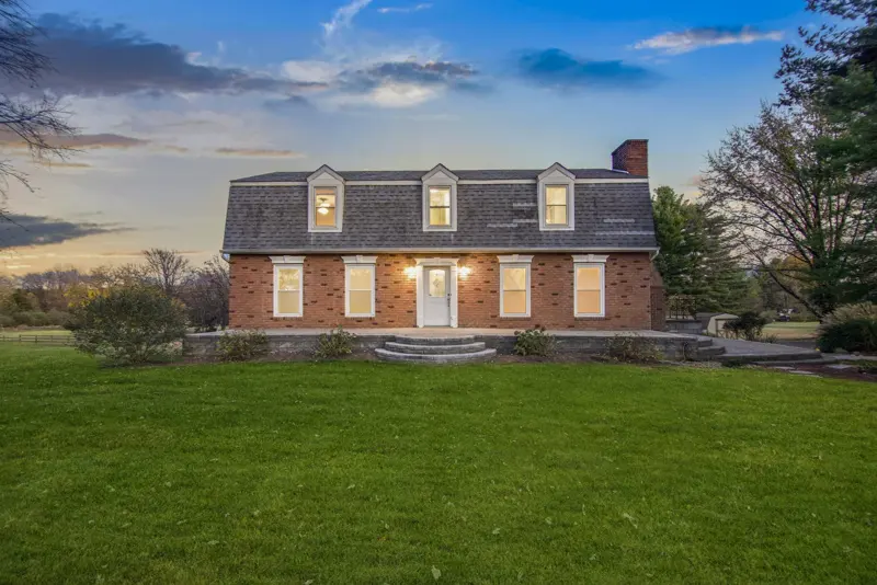 Brick colonial at dusk