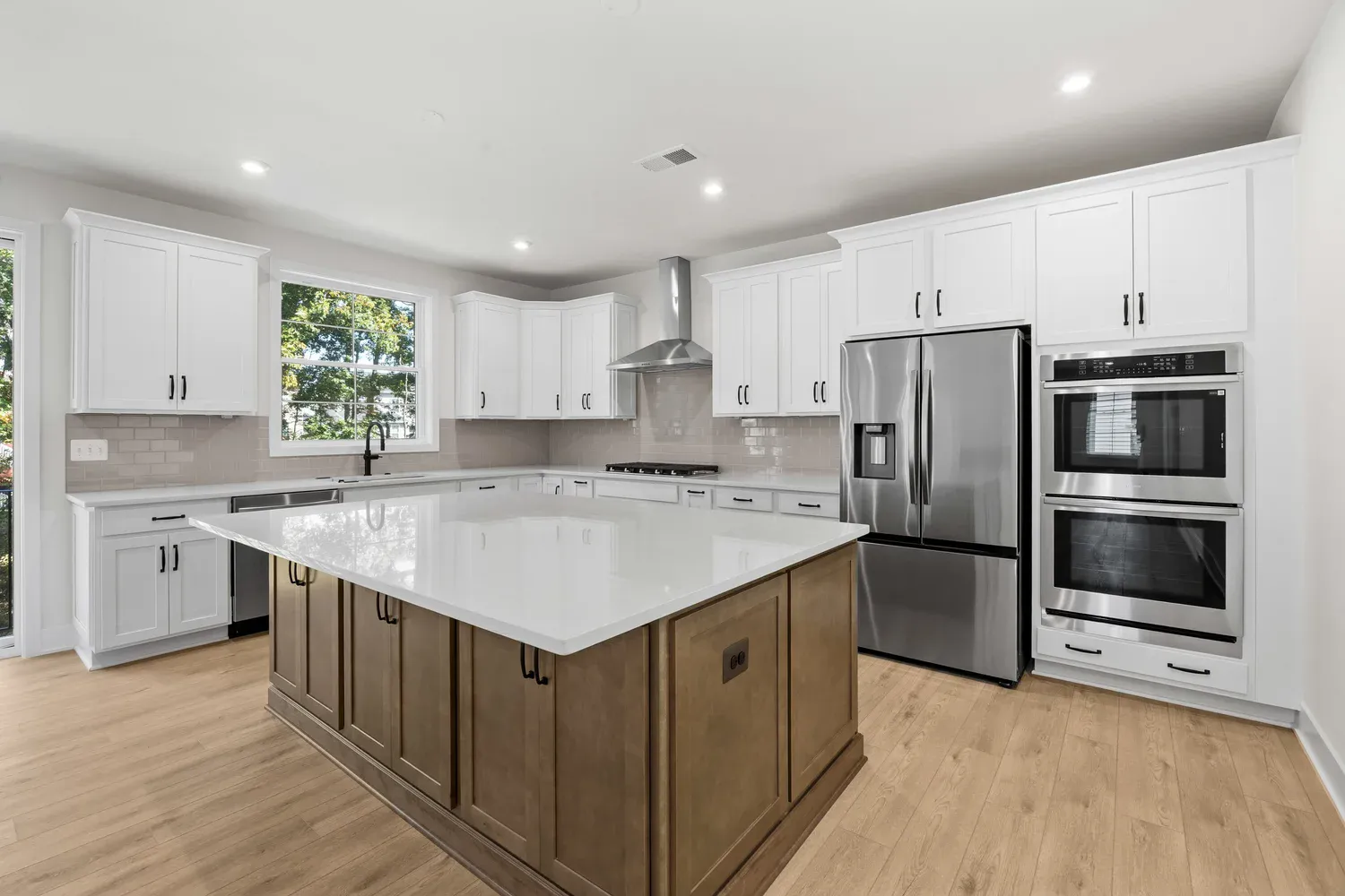 White kitchen with a large island