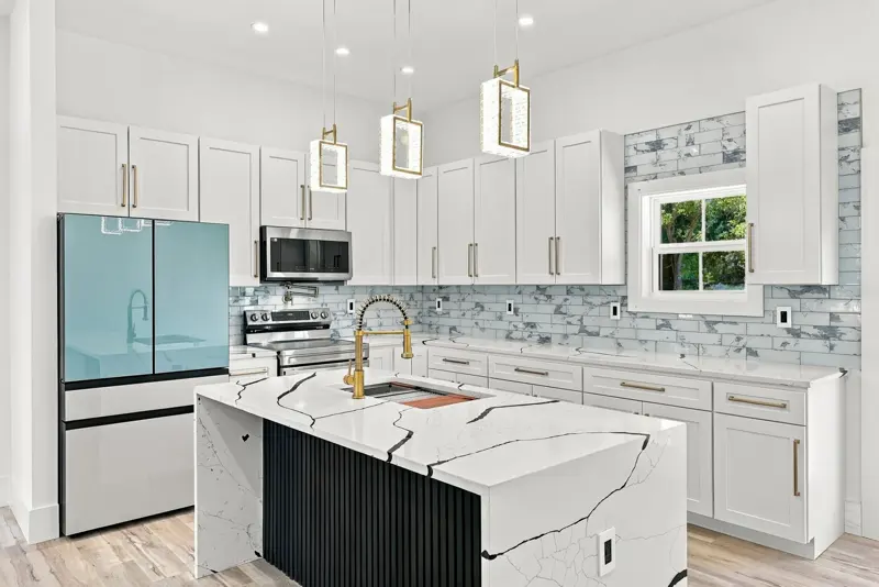 Bright white kitchen with a quartz island